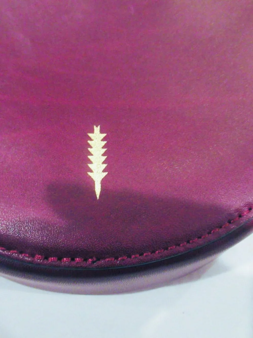 Thacker burgundy purse, both a crossbody and a bracelet handle